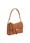 Side view of the tan leather bag with shoulder strap and top handle