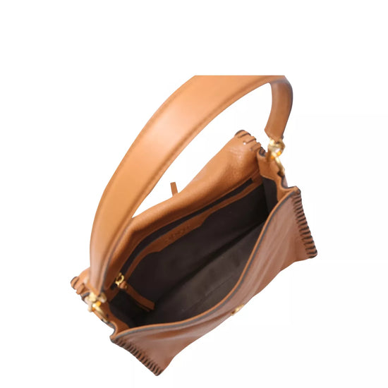 Inside view of tan leather bag