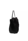 black rectangular small shearling bag with a small top handle and removable cross body strap from abro side view