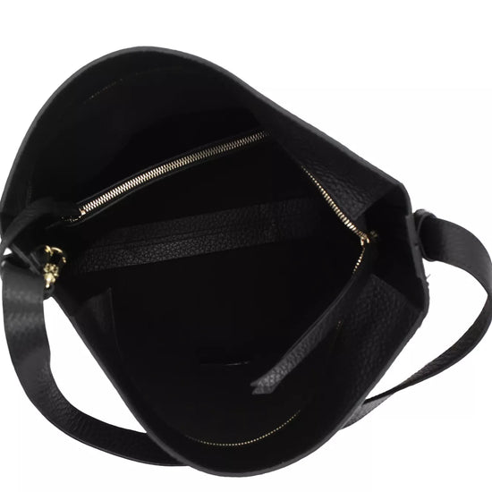Black leather shoulder bag shown from an overhead angle, displaying its interior with a zippered compartment and a black strap against a white background.