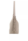 A light taupe pebbled leather shoulder bag shown from the side profile against a solid white background.