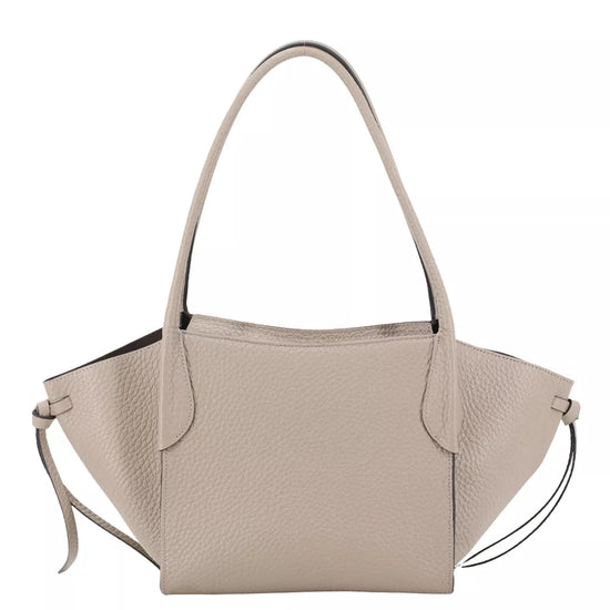 A light beige pebbled leather tote bag with dual top handles and a thin matching shoulder strap, shown against a plain white background.