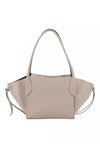 A light beige pebbled leather tote bag with dual top handles and a thin matching shoulder strap, shown against a plain white background.