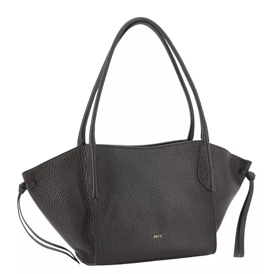 A black pebbled leather tote bag with dual top handles, a small gold 'MCI' logo on the front, and a matching leather tassel detail on the side, shown against a plain white background.