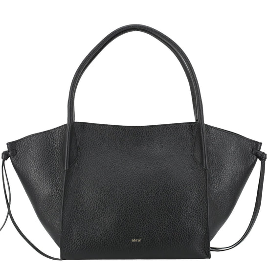 A black pebbled leather handbag with a wide, structured silhouette, dual top handles, and a thin shoulder strap, shown against a plain white background.