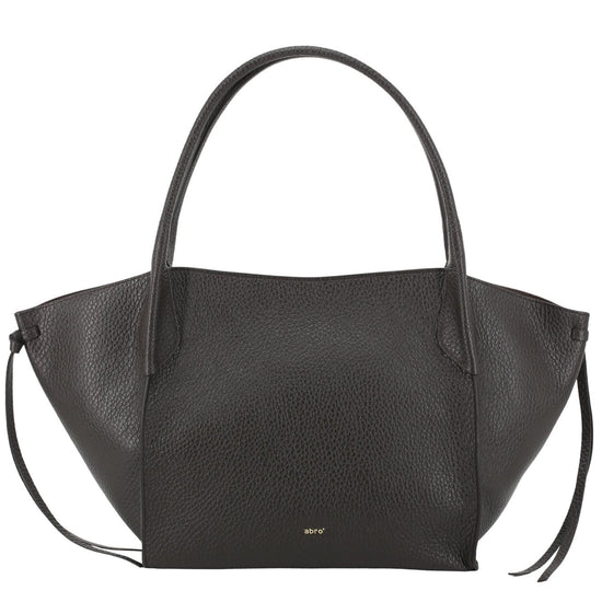 A brown pebbled leather handbag with a structured, asymmetrical silhouette, double top handles, and a small gold 'MNY' logo on the front, set against a plain white background.