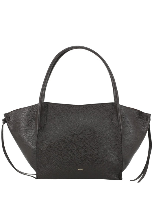 A brown pebbled leather handbag with a structured, asymmetrical silhouette, double top handles, and a small gold 'MNY' logo on the front, set against a plain white background.