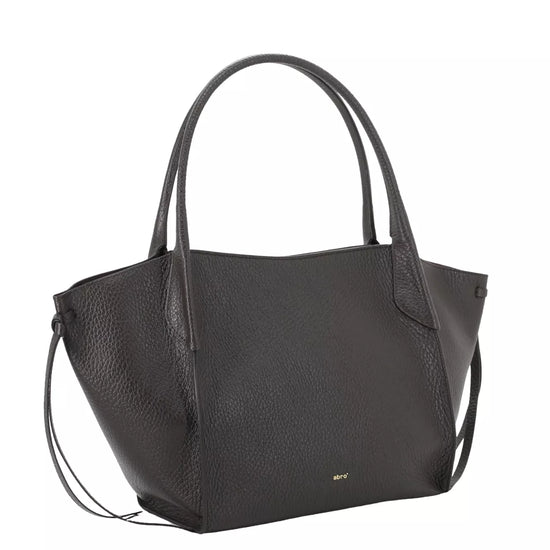 A brown pebbled leather tote bag with double top handles and a small gold logo on the front, shown against a plain white background.
