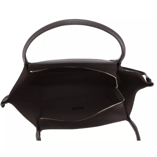 The interior of a dark brown textured leather handbag with a single top handle, shown against a plain white background.