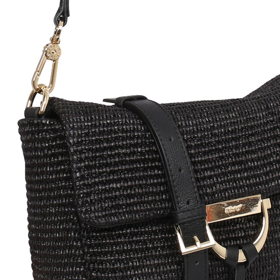 Close up raffia and leather handbag with gold toned hardwear from Abro