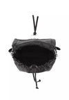 A black leather and canvas drawstring pouch bag shown from a top-down view, featuring a silver-tone metal ring and black drawstrings, on a solid white background.