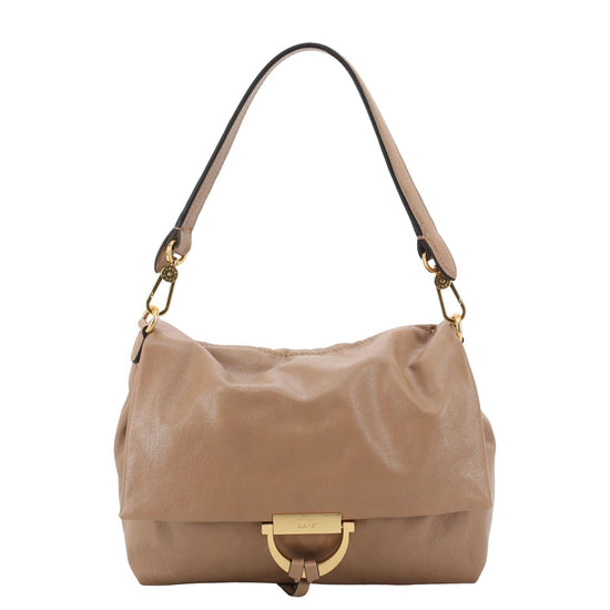 A beige leather shoulder bag with a gold-tone D-ring closure and a black strap accent, shown against a plain white background.