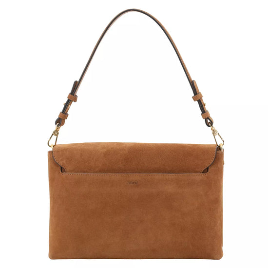 A tan suede shoulder bag with a matching leather shoulder strap and gold-tone hardware, shown against a plain white background.