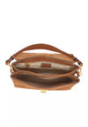 An open brown suede shoulder bag with gold-tone hardware, showing its interior compartments and a tan leather brand patch that reads 'abco'.