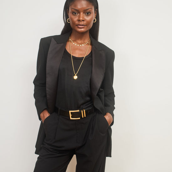 Model shot wearing 2 layered necklaces