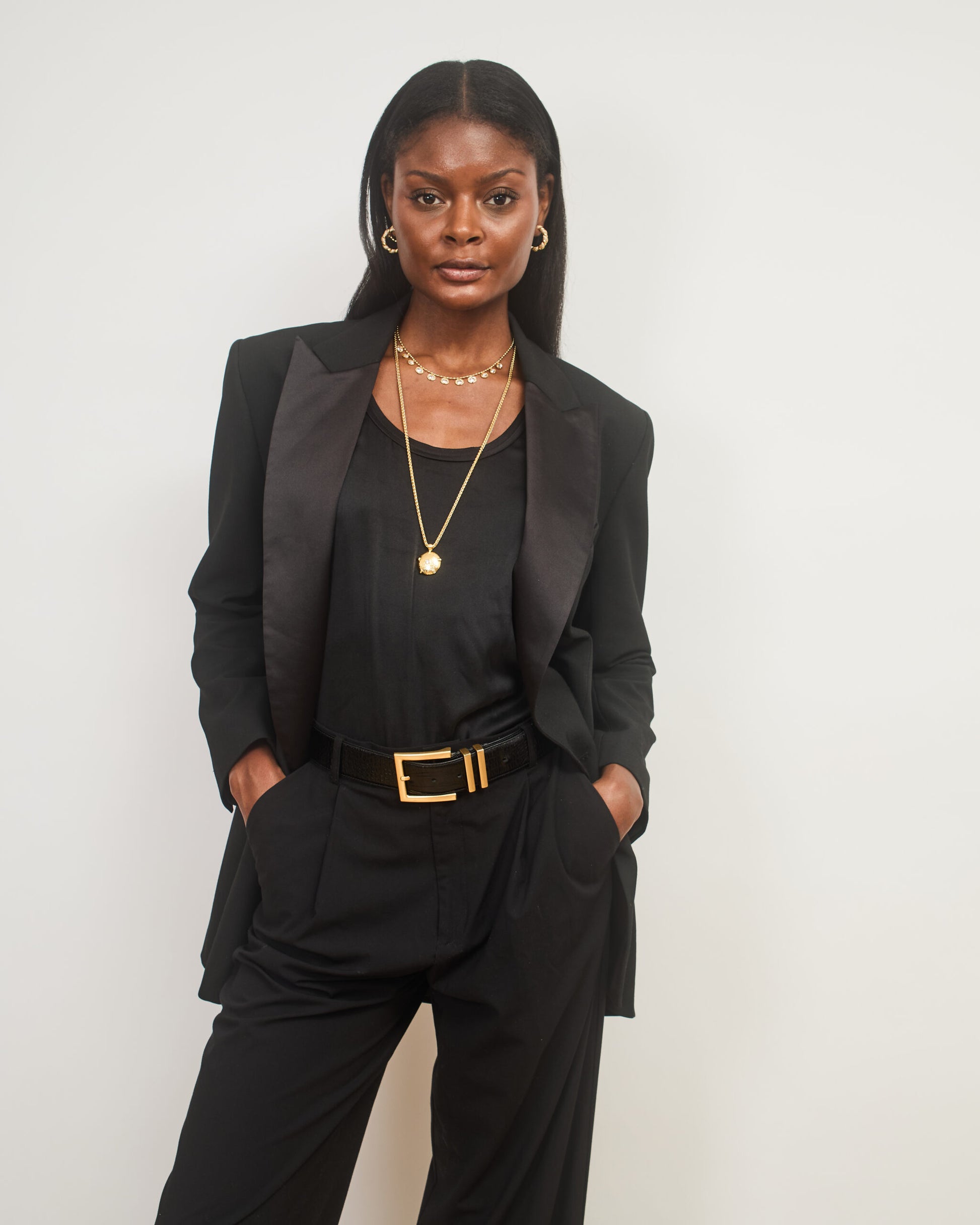 Model shot wearing 2 layered necklaces