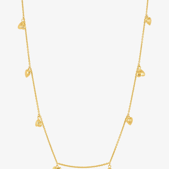 gold necklace with gold heart charms with a lobster clasp from rachel jackson