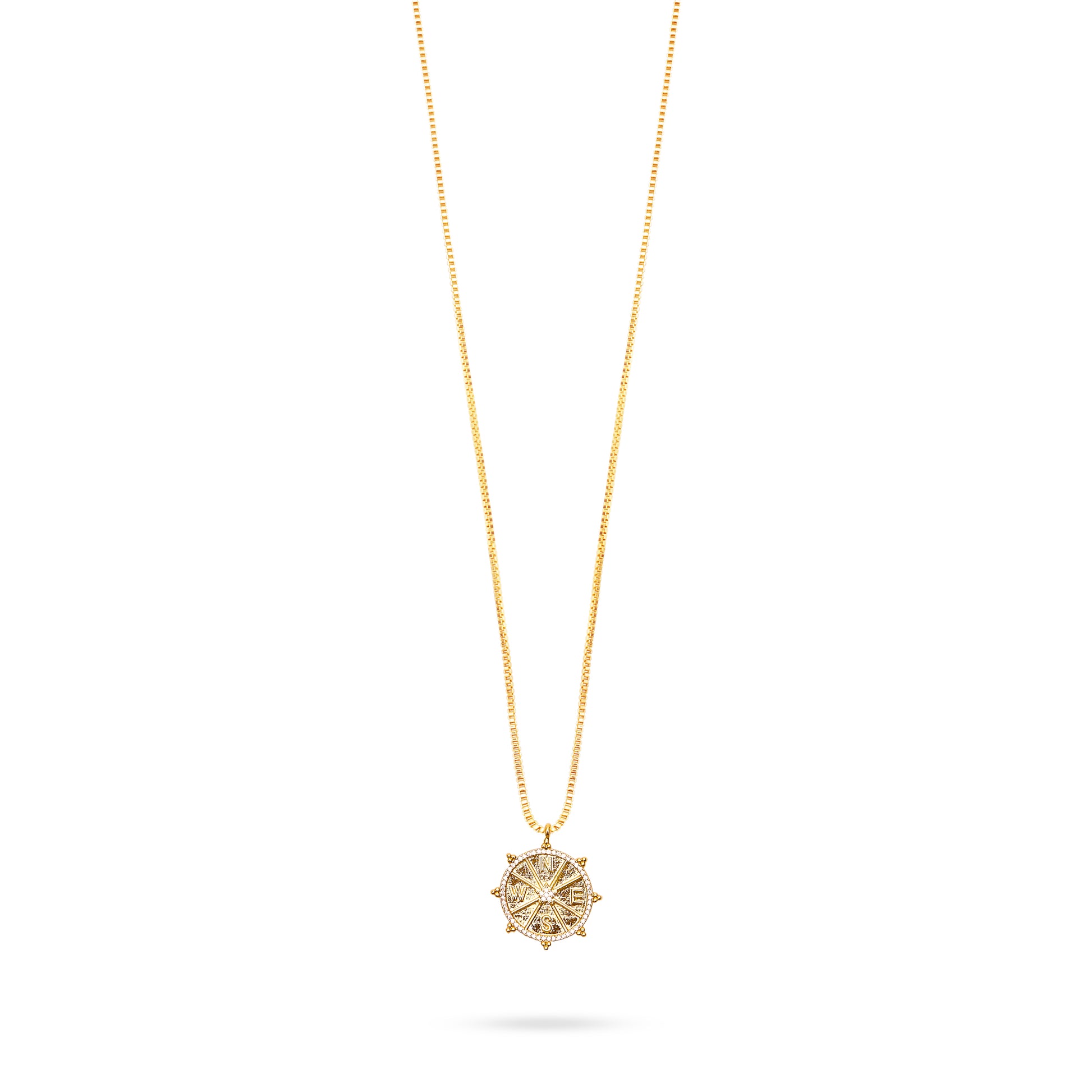 gold compass pendant necklace with delicate gold chain and lobster clasp close up