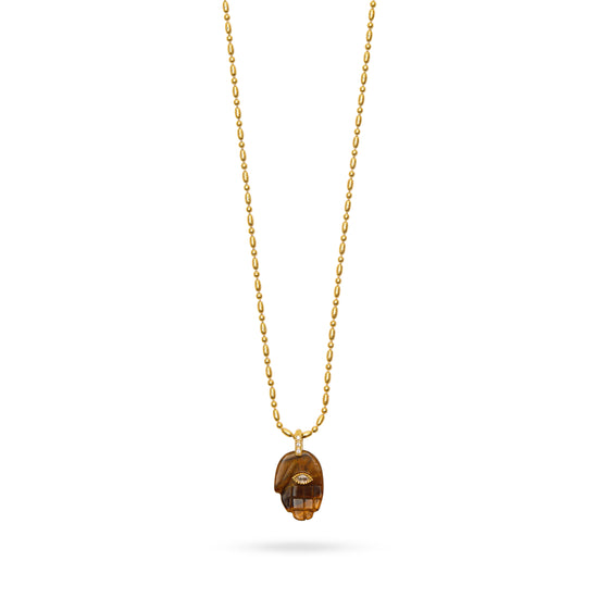 tigers eye hand pendant with evil eye and gold bamboo chain close up