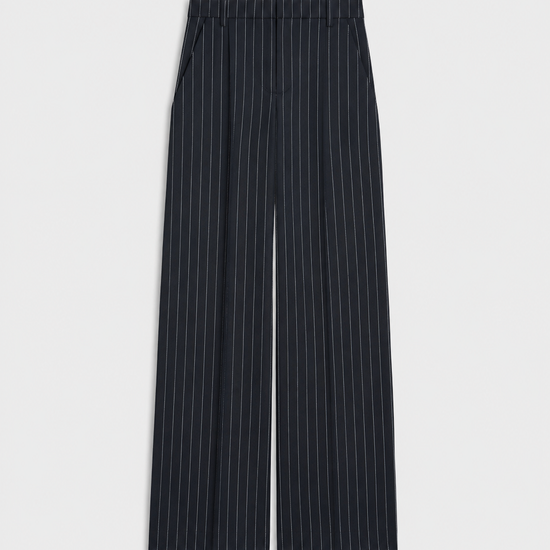 A pair of dark navy blue wide-leg trousers with thin white vertical pinstripes, shown flat against a light gray background.