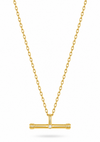 A gold chain necklace with a T-bar pendant featuring a small central clear gemstone, shown on a clean white background.