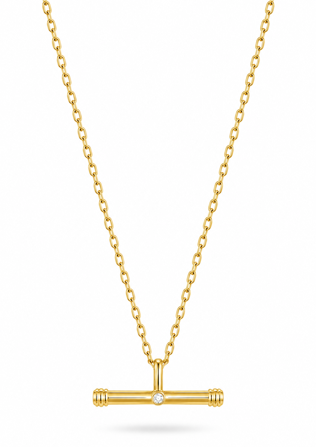 A gold chain necklace with a T-bar pendant featuring a small central clear gemstone, shown on a clean white background.