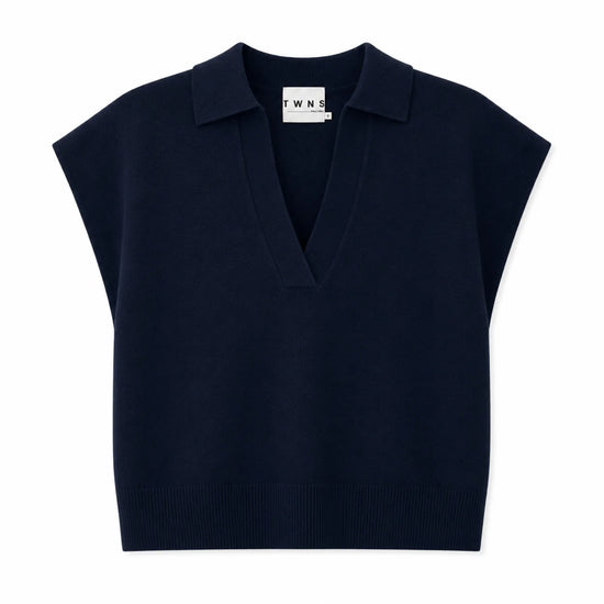 A navy blue knit polo vest with cap sleeves and a V-neckline, shown flat against a plain white background.