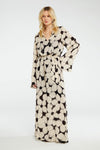 long sleeved dress in black with a white flower print with removable self tie belt