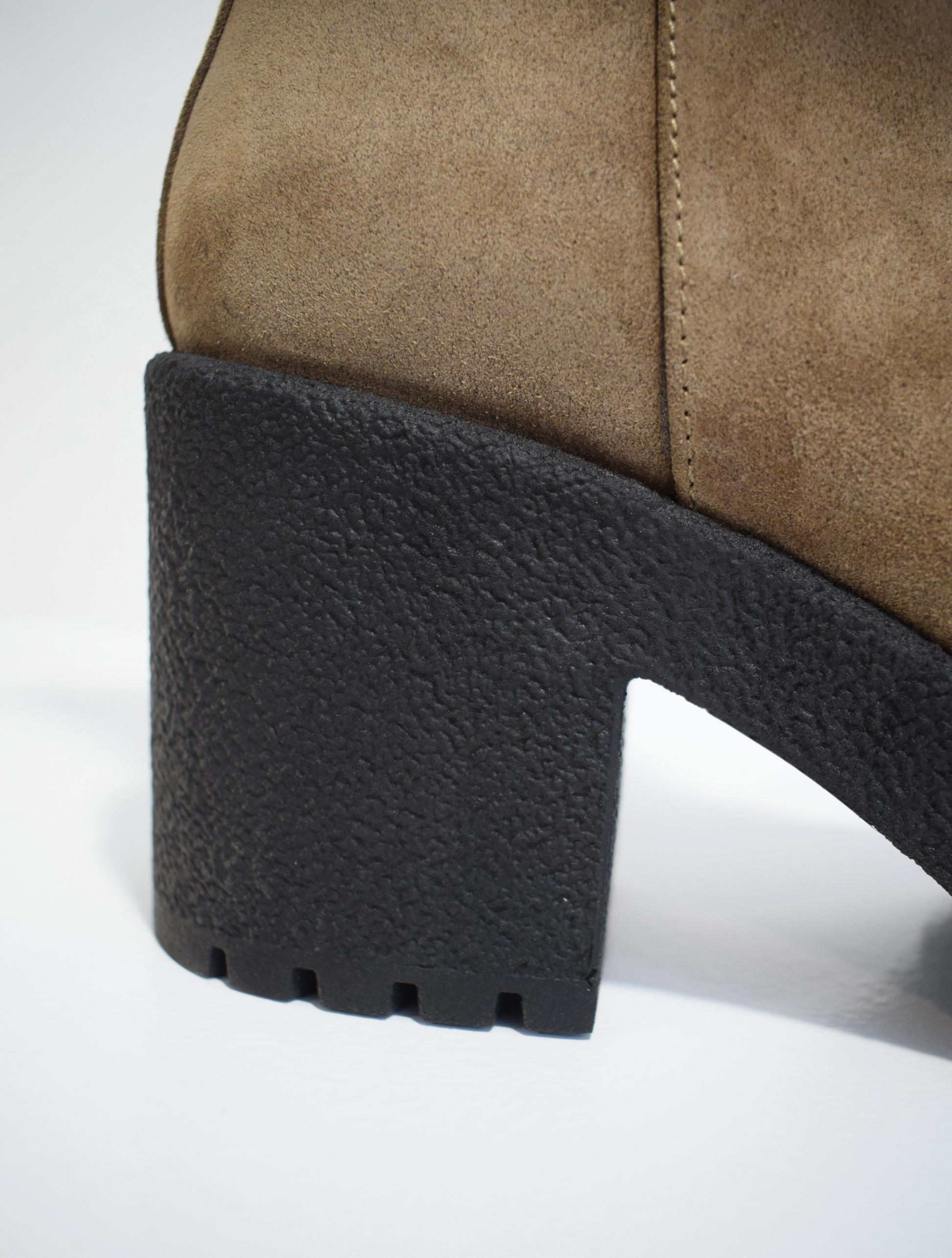 Taupe brown suede ankle boot with crepe black moulded rubber platform sole and heel