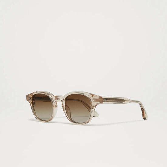 Ecru Italian acetate sunglasses with a slightly rounded shape and light brown lenses