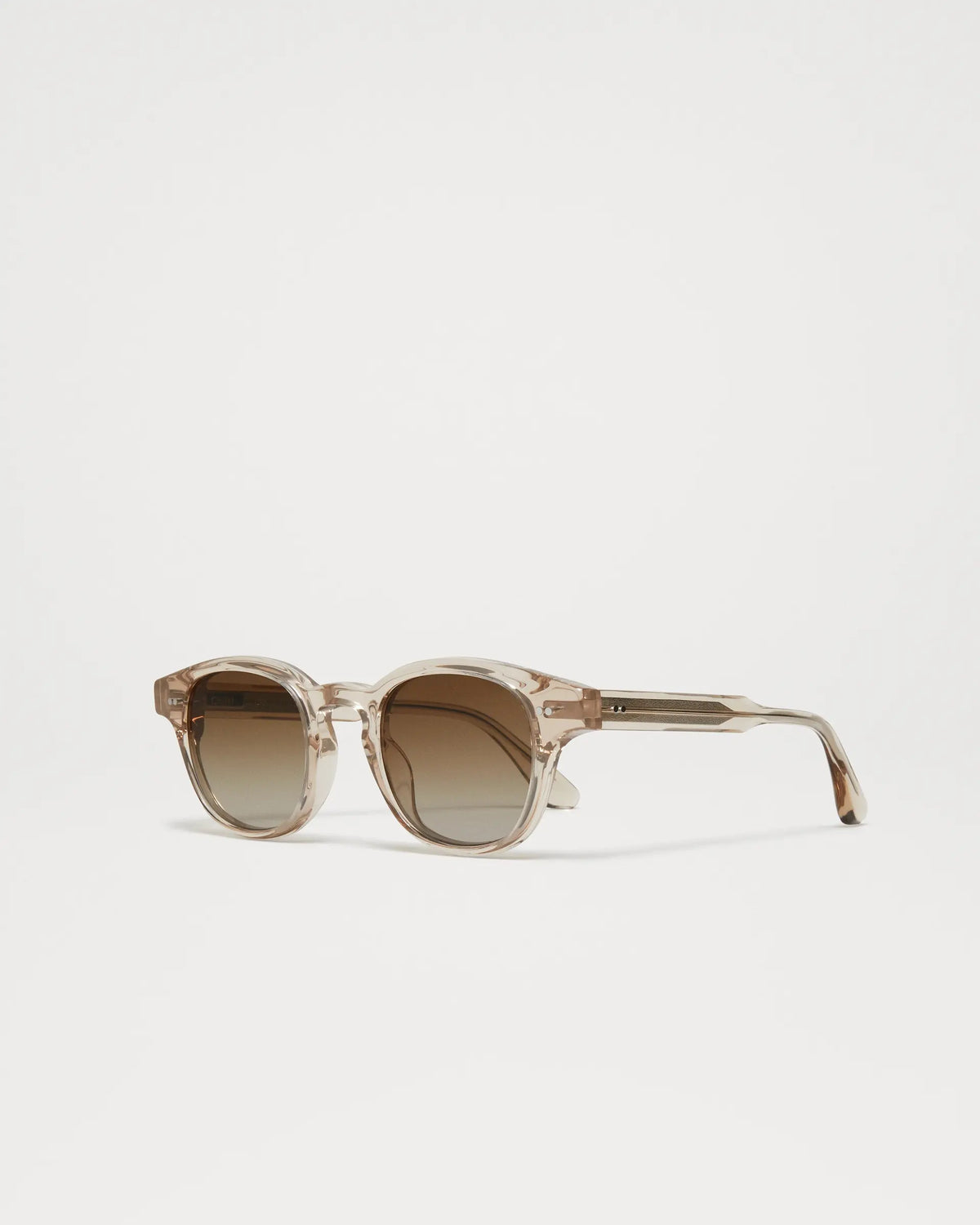 Ecru Italian acetate sunglasses with a slightly rounded shape and light brown lenses
