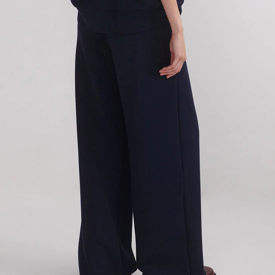 extra wide leg navy elasticated waistband trousers from varley rear view