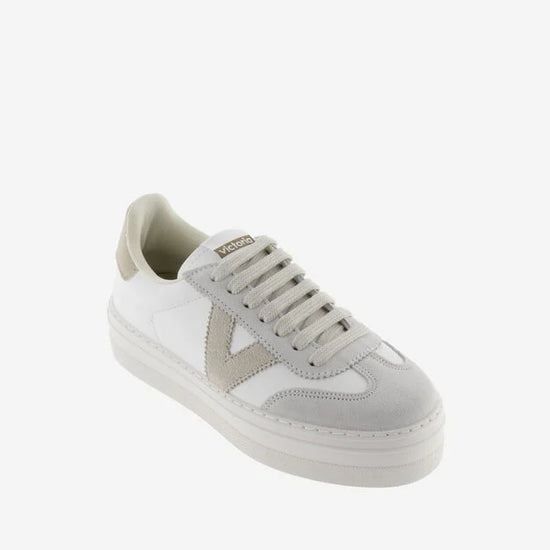 white platform trainers with beige suede v on side  