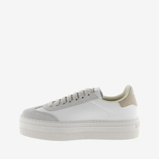 white platform trainers with beige suede v on side  side view
