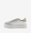 white platform trainers with beige suede v on side  side view