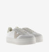 white platform trainers with beige suede v on side front view