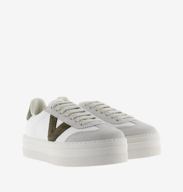 white platform trainers with green suede v on side from victoria front view