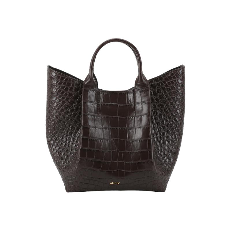 dark brown bucket bag with croc leather design and gold abro emblum on front