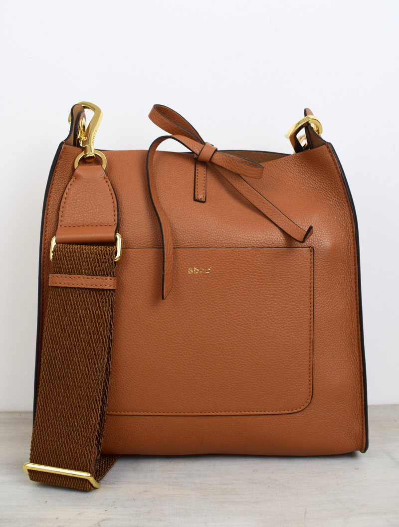 Brown leather bag with cross body strap and front pocket detail