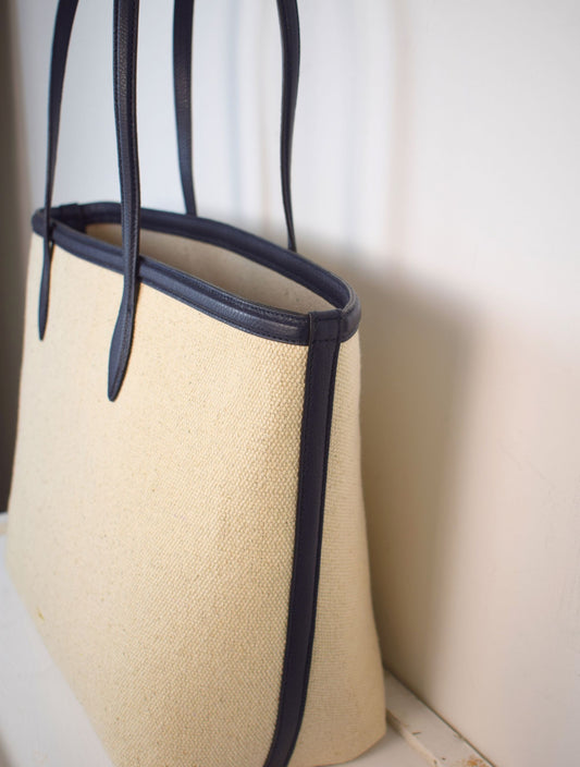 Natural fabric shopper with navy leather trim and internal zippable pouch pocket detail