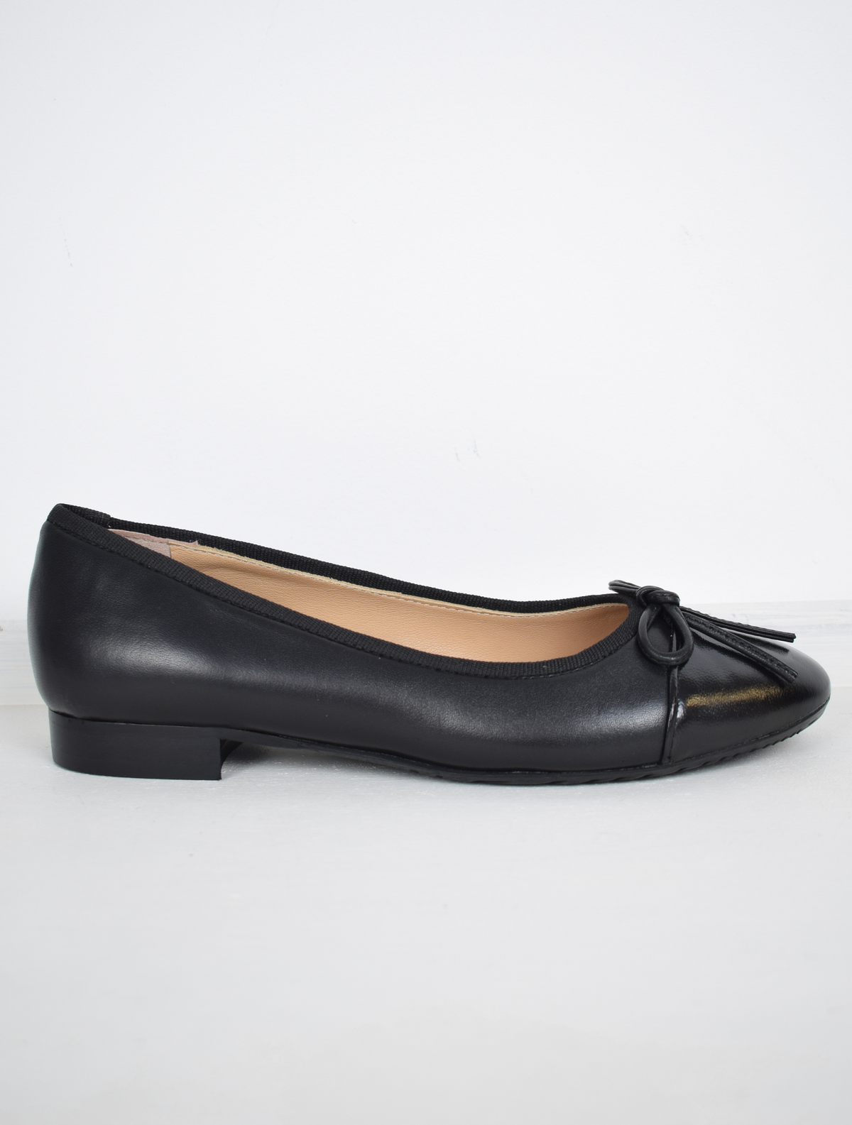 Black leather ballet flats with bow detail
