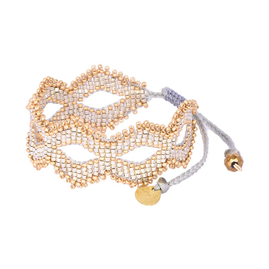 gold and silver beaded bracelet with diamond shape design