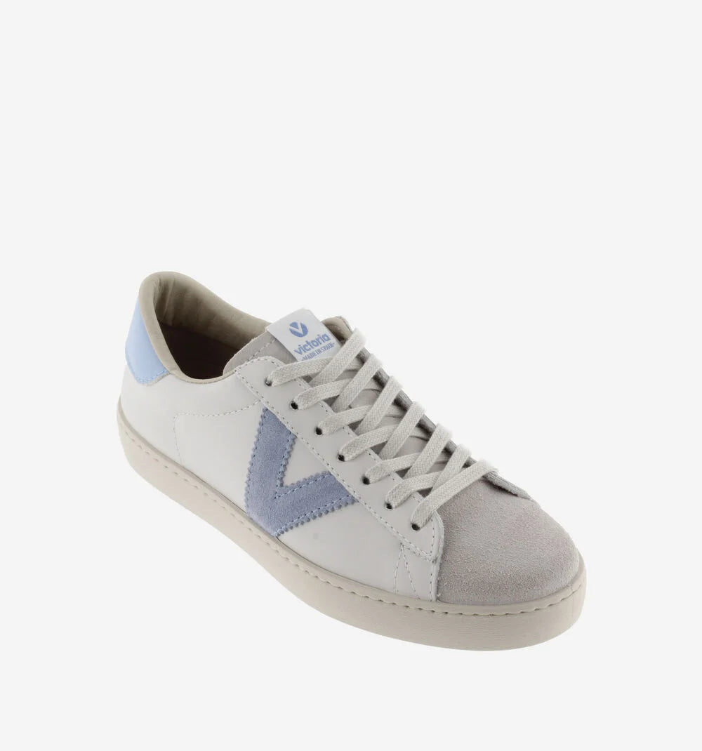 White leather pumps with suede toe flat rubber sole and contrast light blue "V" on the outer side and heel tab