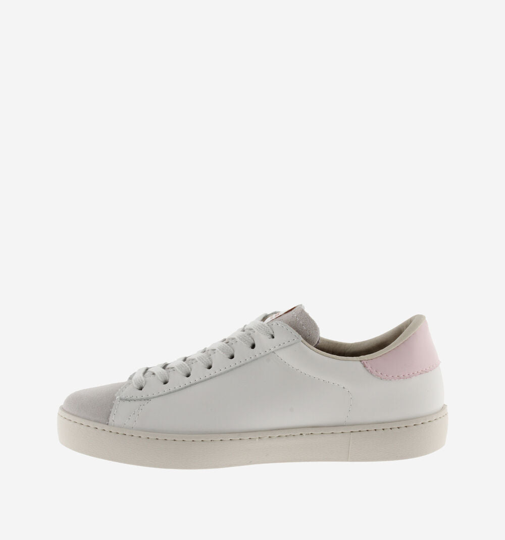 White leather pumps with suede toe flat rubber sole and contrast light pink "V" on the outer side and heel tab