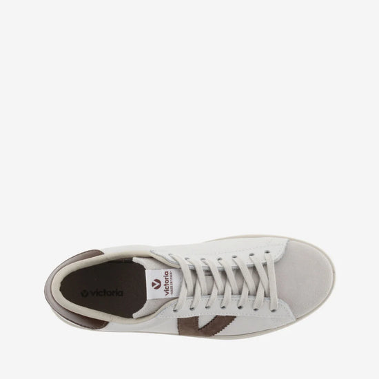 white faux leather trainers with suede top and chocolate brown v and back birds eye view