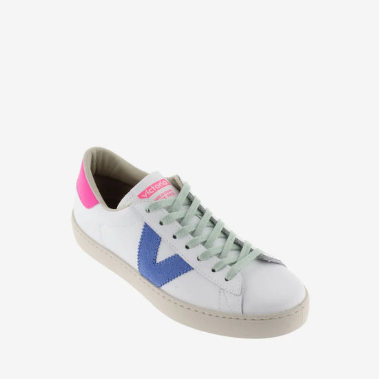 White faux leather trainer with green laces and contrast pink heel tab and suede blue V on outer side