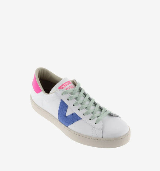 White faux leather trainer with green laces and contrast pink heel tab and suede blue V on outer side