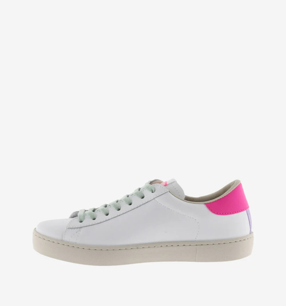 White faux leather trainer with green laces and contrast pink heel tab and suede blue V on outer side