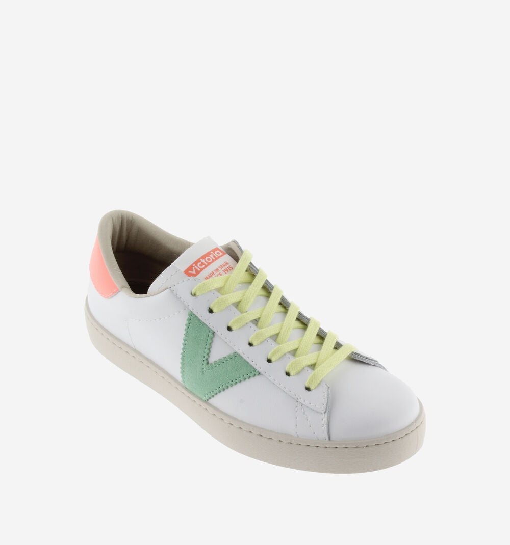 White faux leather trainer with yellow laces and contrast coral heel tab and green blue V on outer side