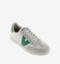 White leather pumps with suede toe flat rubber sole and contrast green "V" on the outer side and heel tab